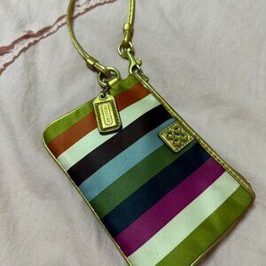Vintage Coach Legacy Wristlet with gold trim.
